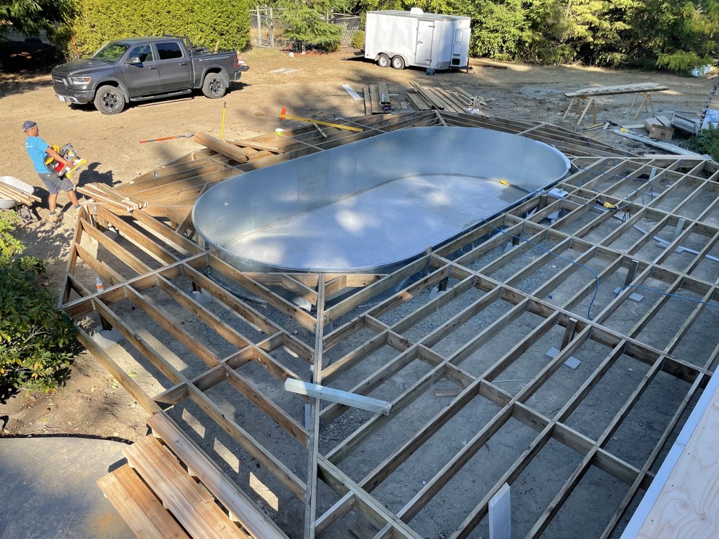 Deck framing built out around a spa shell during a VIP Homes build