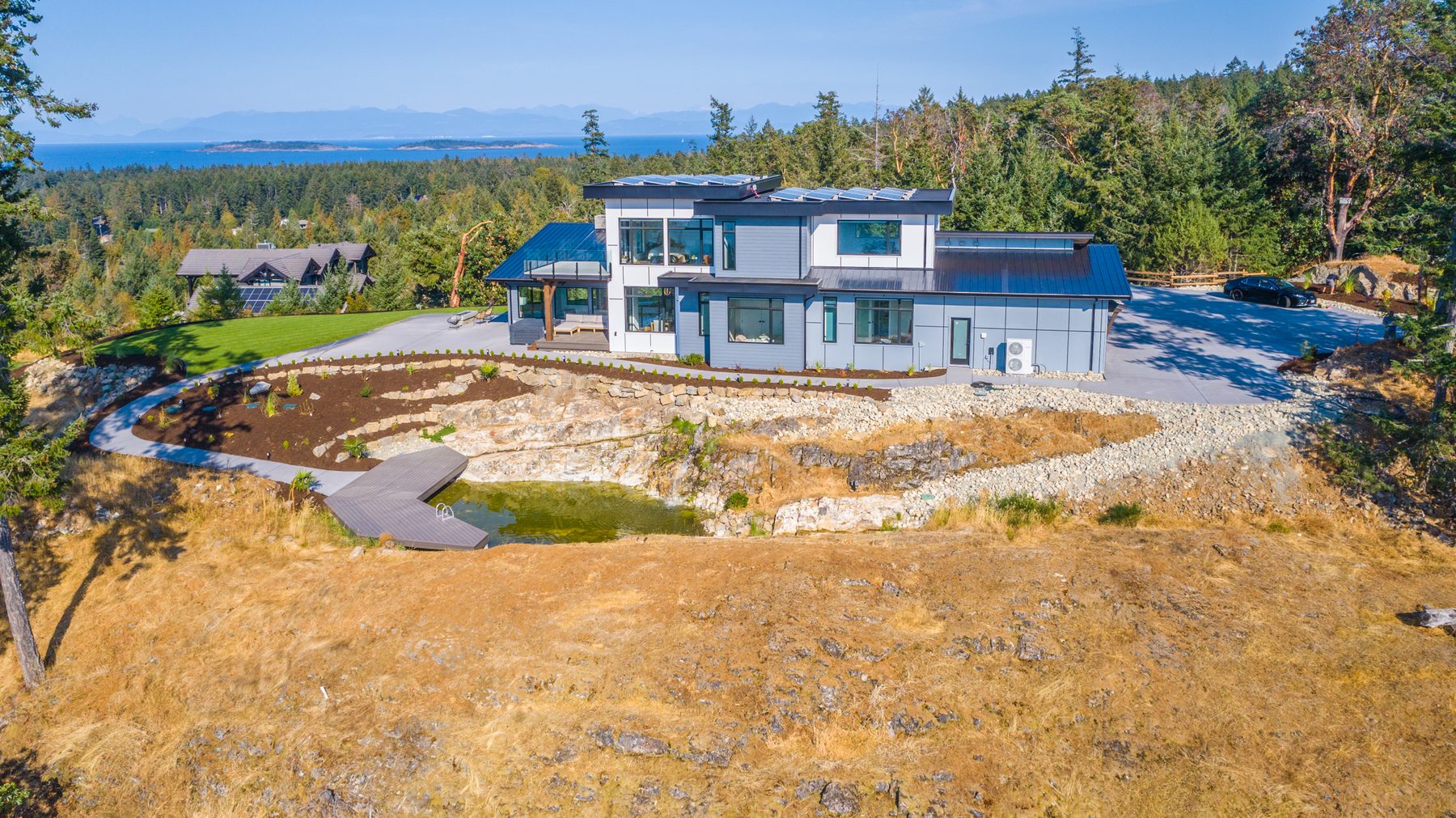 Aerial view of a custom Sea Ridge home by VIP Homes overlooking the ocean in Oceanside BC