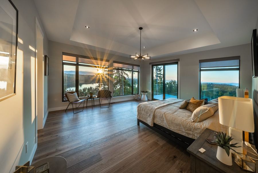 Bright primary bedroom suite in a custom home