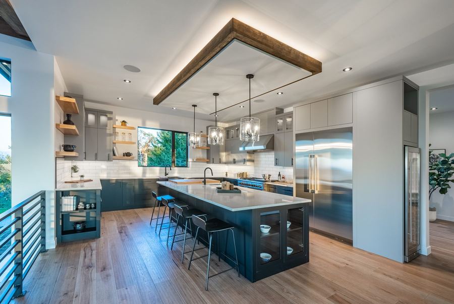Finished chef's kitchen with custom cabinetry and large island
