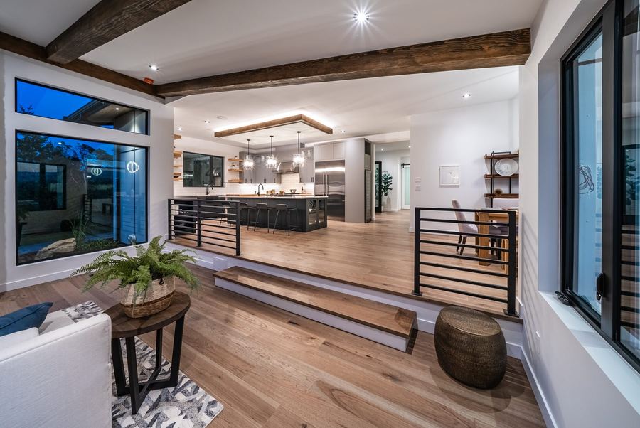 Open plan living room flowing into kitchen and dining