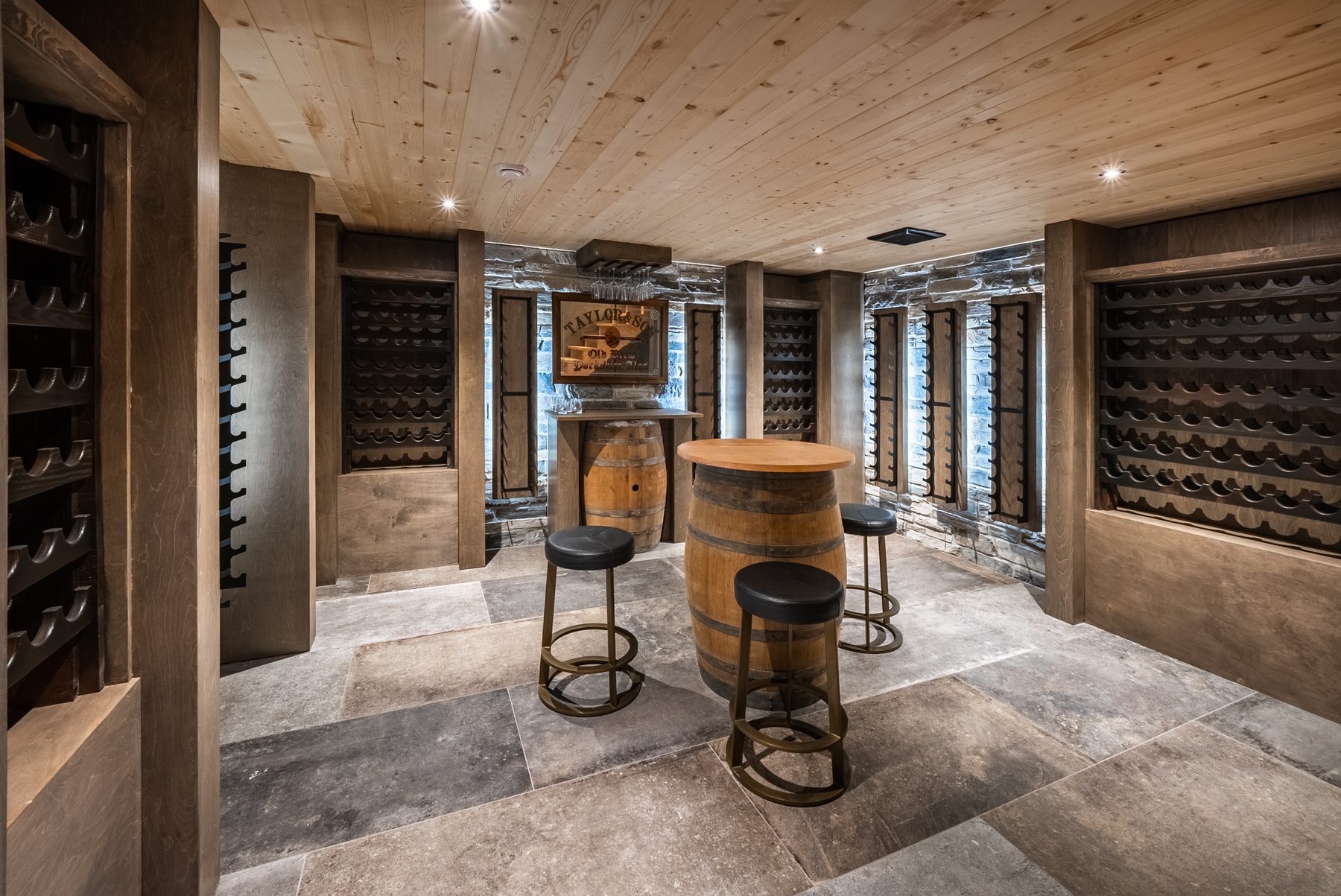 Custom wine cellar with timber racking and barrel seating